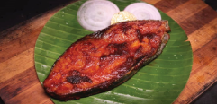 FRIED FISH IN SERVED IN THE BANANA LEAF